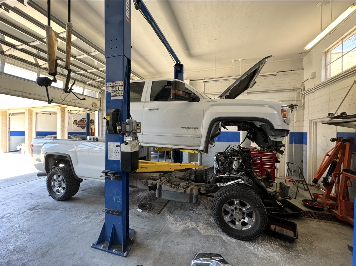 Truck up on the lift with engine work in progress